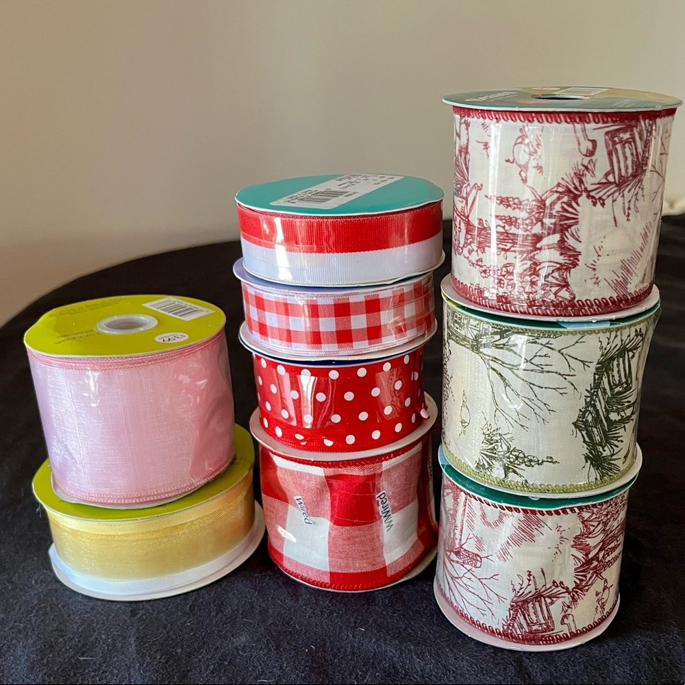 Lot of nine brand-new in package crafting, decorating ribbons. never opened.